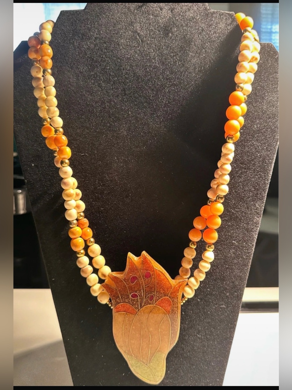 vintage multi-strand beaded necklace handmade with a carved statement.